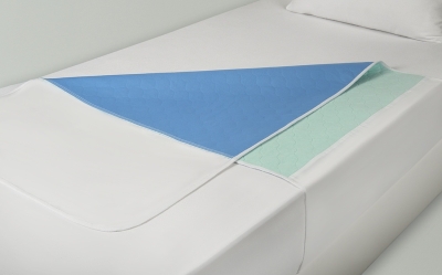 Washable mattress overlay with tuck-in flaps